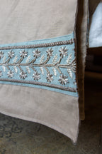 Linen throws with embroided linen trim detail