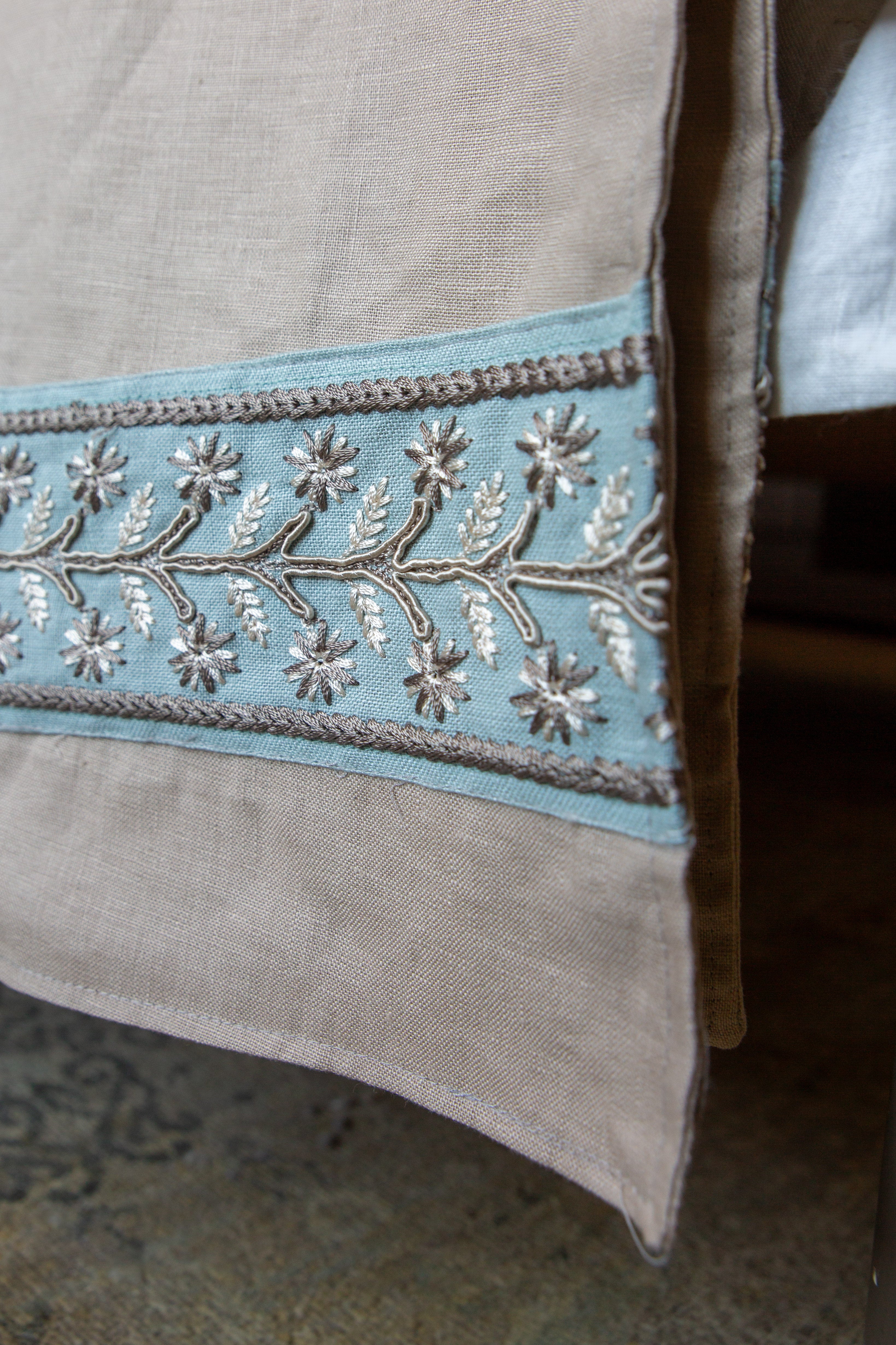 Linen throws with embroided linen trim detail